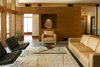 Modern home with Living Room, Concrete Floor, Coffee Tables, Chair, and Gas Burning Fireplace. Living room Photo of High Desert Pavillion