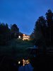 Modern home with Exterior, Cabin Building Type, Wood Siding Material, Glass Siding Material, and Gable RoofLine. View from pond. Photo 8 of Hockley Valley Chalet Renovation