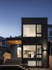 Modern home with Exterior, House, Flat RoofLine, Metal Siding Material, Glass Siding Material, and Wood Siding Material. Dusk view of addition from garden Photo of North Toronto Addition