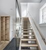 Modern home with Staircase, Glass Railing, Wood Tread, and Wood Railing. View of Staircase Photo 4 of North Toronto Addition
