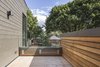 Modern home with Outdoor, Rooftop, Small Patio, Porch, Deck, Horizontal Fences, Wall, Wood Fences, Wall, Decking Patio, Porch, Deck, and Trees. Second Floor Balcony Photo 7 of North Toronto Addition