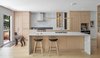 Modern home with Kitchen, Light Hardwood Floor, Wood Cabinet, Range, Refrigerator, Wood Counter, Undermount Sink, Beverage Center, Stone Slab Backsplashe, Marble Counter, and Pendant Lighting. Kitchen Photo 8 of North Toronto Addition
