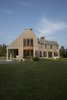 Modern home with Exterior, House Building Type, Shingles Roof Material, Wood Siding Material, and Gable RoofLine. West face (dining room, guest bedroom) Photo 4 of Deep Cove House