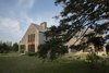 Modern home with Exterior, House Building Type, Shingles Roof Material, Wood Siding Material, and Gable RoofLine. Western facade from the garden Photo 7 of Deep Cove House