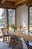 Modern home with Dining Room, Chair, Table, Ceiling Lighting, Limestone Floor, and Wood Burning Fireplace. Dining room Photo 9 of Deep Cove House