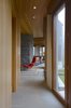 Modern home with Hallway and Limestone Floor. Southwest hall, from kitchen looking towards the living room Photo 10 of Deep Cove House