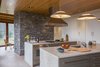 Modern home with Limestone Floor and Ceiling Lighting. Kitchen, looking towards the dining room Photo 11 of Deep Cove House