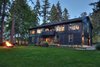 Using a balanced structural layout, designers capitalized on regional building materials such as fir, and cedar. Between the large trim corners, posts, beams generous and strategically placed windows and doors frame magnificent views. Photo 17 of Bentley Longhouse modern home