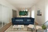 Modern home with Living Room, Sofa, Chair, Coffee Tables, Bookcase, Ceiling Lighting, Pendant Lighting, Wall Lighting, and Medium Hardwood Floor. living room Photo 6 of Colorfull in the white city