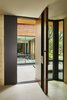 Modern home with Doors, Interior, Wood, Metal, and Swing Door Type. Custom steel and wood front door. Photo 6 of Bent Tree Residence