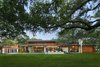 Modern home with Exterior, Flat RoofLine, Wood Siding Material, and House Building Type. Rear view of home taken from the golf course. Photo of Bent Tree Residence