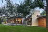 Modern home with Exterior, House Building Type, Wood Siding Material, and Flat RoofLine. Rear view of home. Photo 2 of Bent Tree Residence