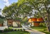 Modern home with Exterior, Metal Roof Material, House Building Type, Wood Siding Material, and Flat RoofLine. Front view of home and guest house/garage. Photo 4 of Bent Tree Residence