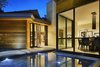 Modern home with Exterior, Metal Roof Material, House Building Type, Flat RoofLine, Wood Siding Material, and Stone Siding Material. Front main entrance featuring walkway floating over water feature. Photo 20 of Bent Tree Residence