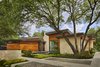 Modern home with Exterior, House Building Type, Flat RoofLine, Wood Siding Material, and Metal Roof Material. Front view of main home. Photo 5 of Bent Tree Residence