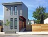 Modern home with Exterior, House Building Type, Metal Roof Material, Concrete Siding Material, and Shed RoofLine. Exterior Front View Photo 8 of The Gilmore House