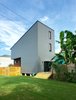 Modern home with Exterior, House Building Type, Metal Roof Material, Concrete Siding Material, and Shed RoofLine. Exterior Rear View Photo 9 of The Gilmore House