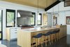 Modern home with Kitchen, White Cabinet, Wood Cabinet, Concrete Floor, Pendant Lighting, Ceiling Lighting, Refrigerator, Range, Range Hood, and Undermount Sink. Henrybuilt Cabinetry Photo 11 of The Landing