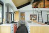 Modern home with Kitchen, Wood Cabinet, Concrete Floor, Engineered Quartz Counter, Ceiling Lighting, Pendant Lighting, Refrigerator, Range, Range Hood, and Undermount Sink. Lacanche Range and Henrybuilt cabinetry in Kitchen and Pantry Photo 12 of The Landing