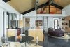 Modern home with Kitchen, Engineered Quartz Counter, White Cabinet, Wood Cabinet, Concrete Floor, Ceiling Lighting, Pendant Lighting, Recessed Lighting, Refrigerator, Range, Range Hood, and Undermount Sink. The Kitchen and Loft Photo 10 of The Landing
