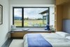 Modern home with Ceiling Lighting, Recessed Lighting, Accent Lighting, and Concrete Floor. Guest Rooms with Custom Murphy Beds and Built-ins Photo 17 of The Landing