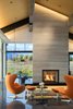 Modern home with Living Room, Chair, Pendant Lighting, Ceiling Lighting, Accent Lighting, Coffee Tables, End Tables, Ottomans, Concrete Floor, Two-Sided Fireplace, and Gas Burning Fireplace. Accent Lights in Great Room Photo 7 of The Landing