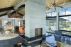 Modern home with Living Room, Concrete Floor, Two-Sided Fireplace, Ceiling Lighting, Coffee Tables, and Gas Burning Fireplace. Great Room Photo 5 of The Landing