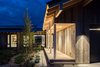 Modern home with Outdoor, Front Yard, Gardens, Flowers, Shrubs, Grass, Hardscapes, Trees, Walkways, Decking Patio, Porch, Deck, Concrete Patio, Porch, Deck, and Metal Patio, Porch, Deck. Entry at Night Photo 2 of The Landing