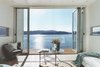Modern home with Living Room, Chair, Sofa, Coffee Tables, Ceiling Lighting, Recessed Lighting, and Light Hardwood Floor. Living Photo 6 of The Cliffhanger House