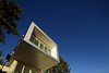 Modern home with Exterior, Flat RoofLine, Wood Siding Material, and House Building Type. South Elevation Photo 2 of The Cliffhanger House
