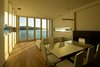 Modern home with Dining Room, Table, Chair, Ceiling Lighting, Medium Hardwood Floor, Gas Burning Fireplace, Standard Layout Fireplace, and Pendant Lighting. Living Photo 9 of The Cliffhanger House