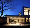 Modern home with Exterior, House Building Type, Wood Siding Material, Shed RoofLine, Metal Siding Material, and Flat RoofLine. Rear patio Photo of The Edge House