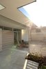 Modern home with Exterior, Wood Siding Material, House Building Type, Metal Siding Material, Flat RoofLine, and Shed RoofLine. Front patio Photo 5 of The Edge House