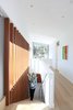Modern home with Staircase, Wood Tread, and Metal Railing. Stair to upper level Photo 13 of The Edge House