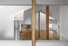 Modern home with Living Room, Table, Chair, Ceiling Lighting, Wall Lighting, and Medium Hardwood Floor. A space that feels a connection of family members. Photo 9 of House in Ohue