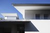 Modern home with Exterior, House Building Type, Wood Siding Material, Metal Roof Material, Stucco Siding Material, and Gable RoofLine. Eaves detail. Photo 4 of House in Ohue