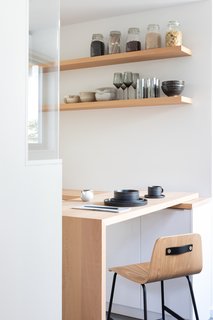 A custom waterfall countertop in the kitchen adds to the home’s sense of serenity and continuity.