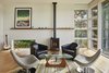 Modern home with Living Room, Chair, Stools, Ceiling Lighting, Light Hardwood Floor, and Gas Burning Fireplace. Brooks Living Room Photo 2 of Brooks Remodel