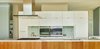 Modern home with Kitchen, Engineered Quartz Counter, White Cabinet, Wood Cabinet, Mosaic Tile Backsplashe, Ceiling Lighting, Refrigerator, Wall Oven, Porcelain Tile Floor, Cooktops, Range Hood, Microwave, and Undermount Sink. Brooks Kitchen Photo 3 of Brooks Remodel