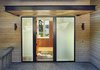 Modern home with Exterior, House, Metal Roof Material, Wood Siding Material, and Hipped RoofLine. Brooks Entry & Canopy Photo 11 of Brooks Remodel