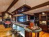 Modern home with Living Room, Medium Hardwood Floor, Gas Burning Fireplace, and Recessed Lighting. Billiard room and bar area, perfect for entertaining Photo 4 of Aspen Vision House