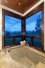 Modern home with Bath Room, Stone Counter, Medium Hardwood Floor, and Recessed Lighting. Jacuzzi tub with natural stone elements and a captivating view Photo 5 of Aspen Vision House