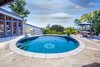 Modern home with Outdoor, Front Yard, Trees, Raised Planters, Hardscapes, Gardens, Plunge Pools, Tubs, Shower, Large Patio, Porch, Deck, Concrete Patio, Porch, Deck, Retaining Fences, Wall, and Landscape Lighting. Spectacular J. Lamont Langworthy Pool Home Photo of J. Lamont Langworthy Design