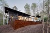 Modern home with Exterior, House, Green Roof Material, Concrete Siding Material, Metal Siding Material, and Flat RoofLine. The deep overhangs seem to float out to provide shade and shelter. Photo 5 of Professor's House
