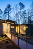 Modern home with Exterior, House, Green Roof Material, Concrete Siding Material, Metal Siding Material, and Flat RoofLine. The floating wood entry bridge at the front, allows for a zero threshold entry. Photo 4 of Professor's House