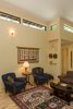 Modern home with Living Room, End Tables, Sofa, Chair, Wall Lighting, and Medium Hardwood Floor. Native American textiles and her collection of rugs from around the world are the main decorations. Photo 14 of Professor's House