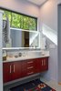 Modern home with Bath Room, Quartzite Counter, Ceramic Tile Floor, Pedestal Sink, Open Shower, Full Shower, Corner Shower, Wall Lighting, Freestanding Tub, Subway Tile Wall, and Two Piece Toilet. A high window provides abundant natural light in the master bathroom. Photo 19 of Professor's House