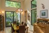 The dining room has views to a small courtyard to the southeast. Native American artifacts adorn the walls and tables. Photo 20 of Professor's House modern home
