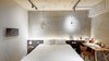Modern home with Bedroom, Track Lighting, Pendant Lighting, Wall Lighting, Bed, Chair, Night Stands, and Concrete Floor. Each of the hotel’s five rooms is carefully curated with handpicked design objects that guests are encouraged to use—unlike most design hotels, the art here isn’t just eye candy. A scan of a QR code pulls up the design products in each room with descriptions and purchasing options. Photo 4 of Play Design Hotel