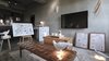 Modern home with Living Room, Table Lighting, Bench, Coffee Tables, Rug Floor, and Concrete Floor. The Guest Selections room lets guests select the Taiwanese design objects they would like in their room, as well as the layout, before they check in. Photo 12 of Play Design Hotel